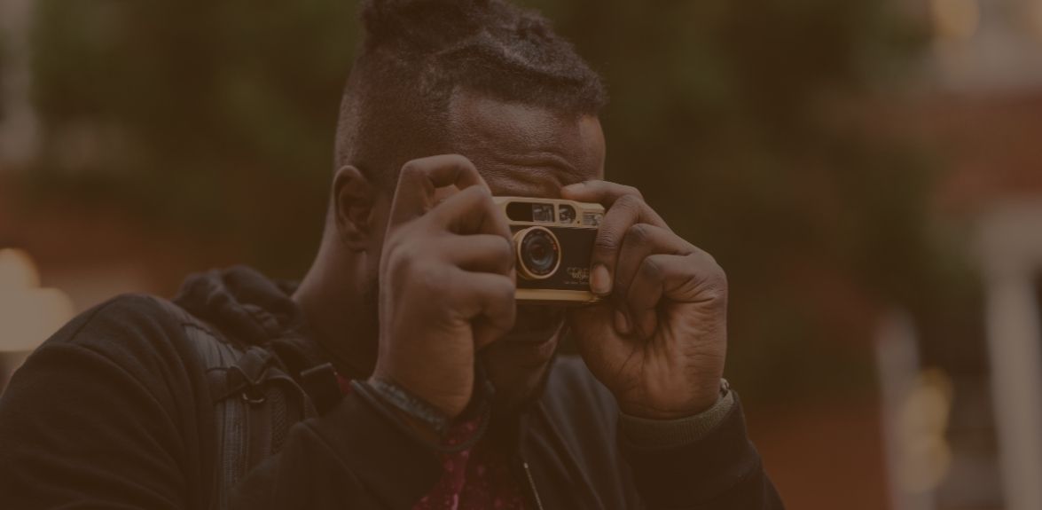 Photo of person taking a photograph